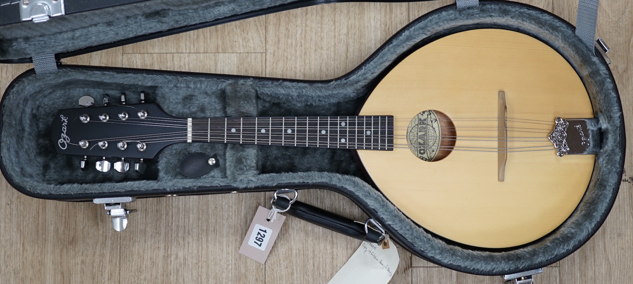 A cased 'Army and Navy' model Ozark mandolin, body length 29cm, in a good hard case